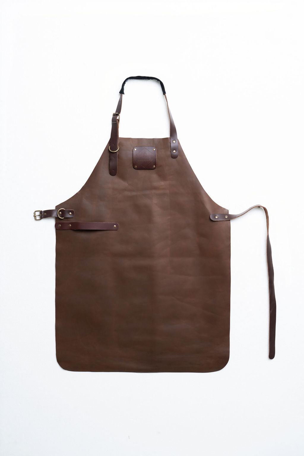 Durable full-length brown leather apron for woodworking and workshop use