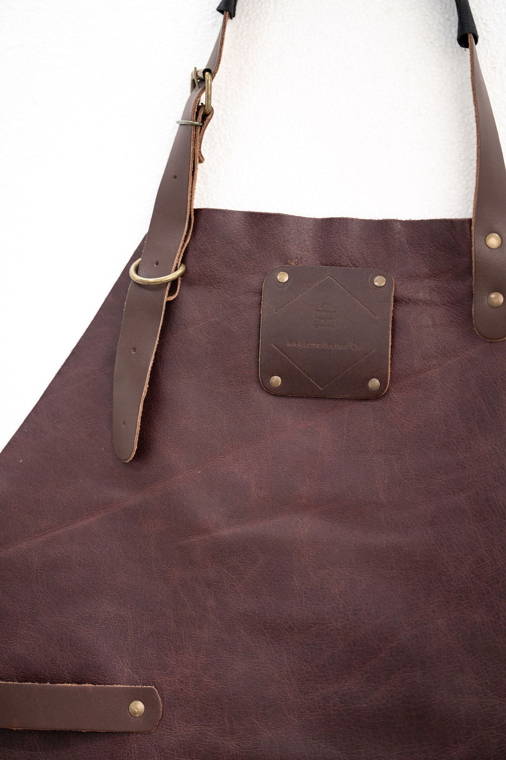 Durable espresso brown leather work apron for woodworking and workshop use