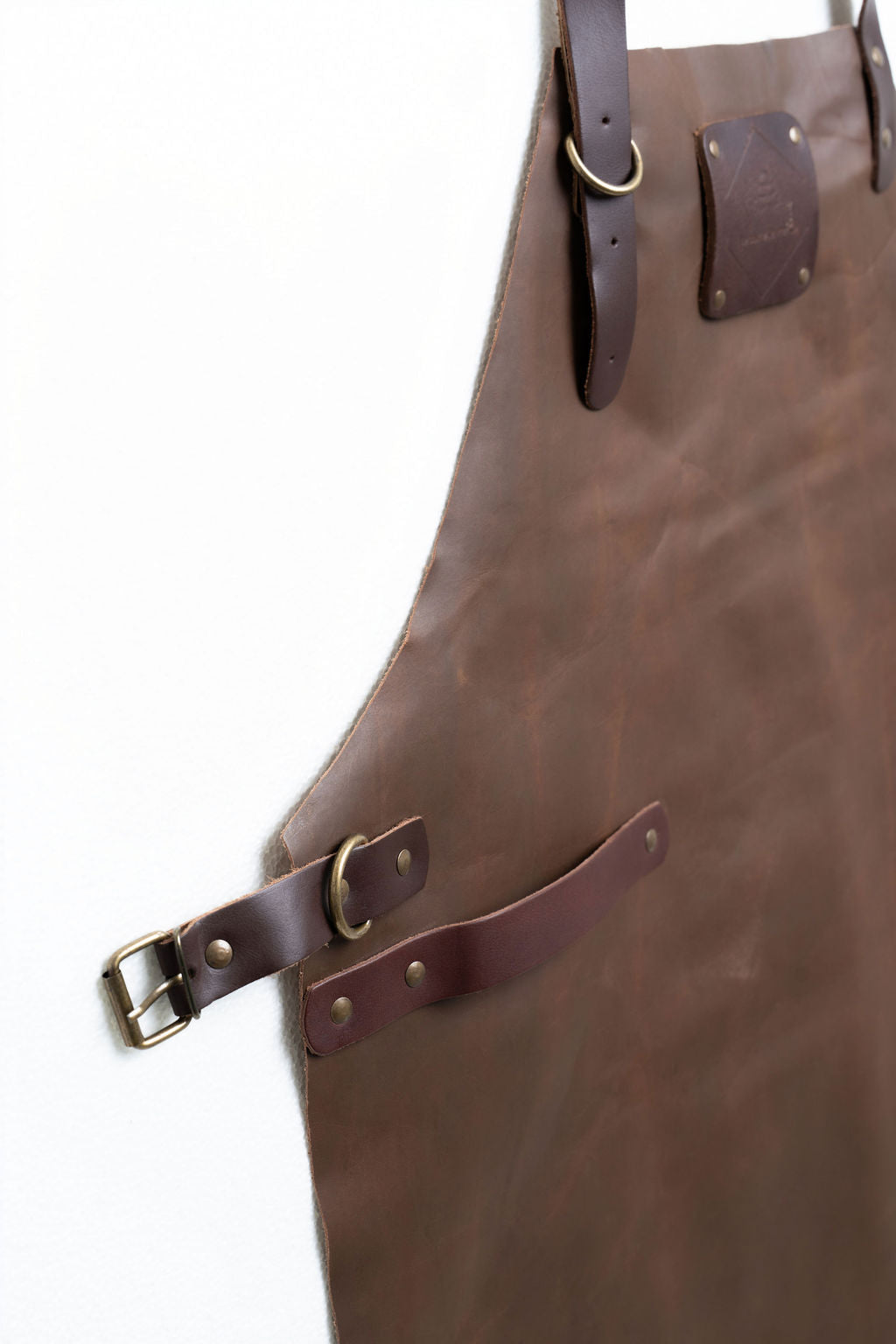 Full coverage leather apron brown with adjustable straps for kitchen use