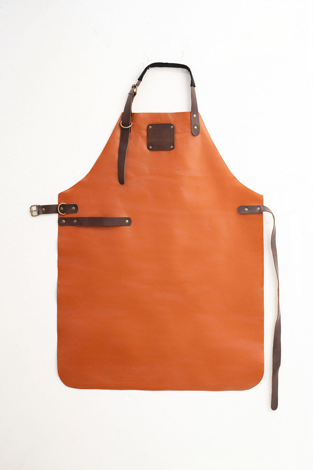 Durable cognac leather work apron for woodworking and workshop use