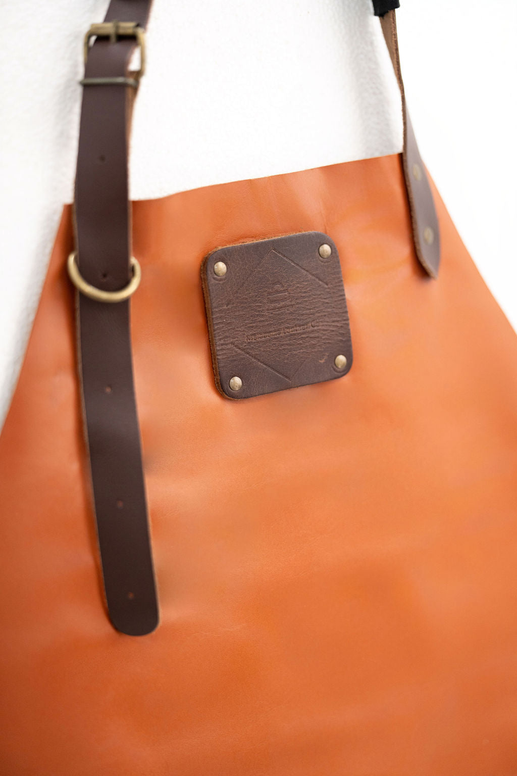 High quality cognac leather apron with strong stitching detail