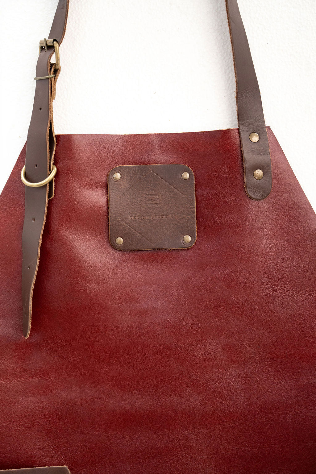 Modern red leather apron minimal design for cooking and crafting