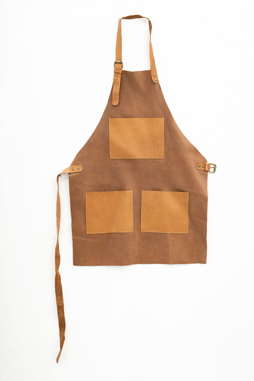 Handcrafted tan leather apron compact design with front pocket storage