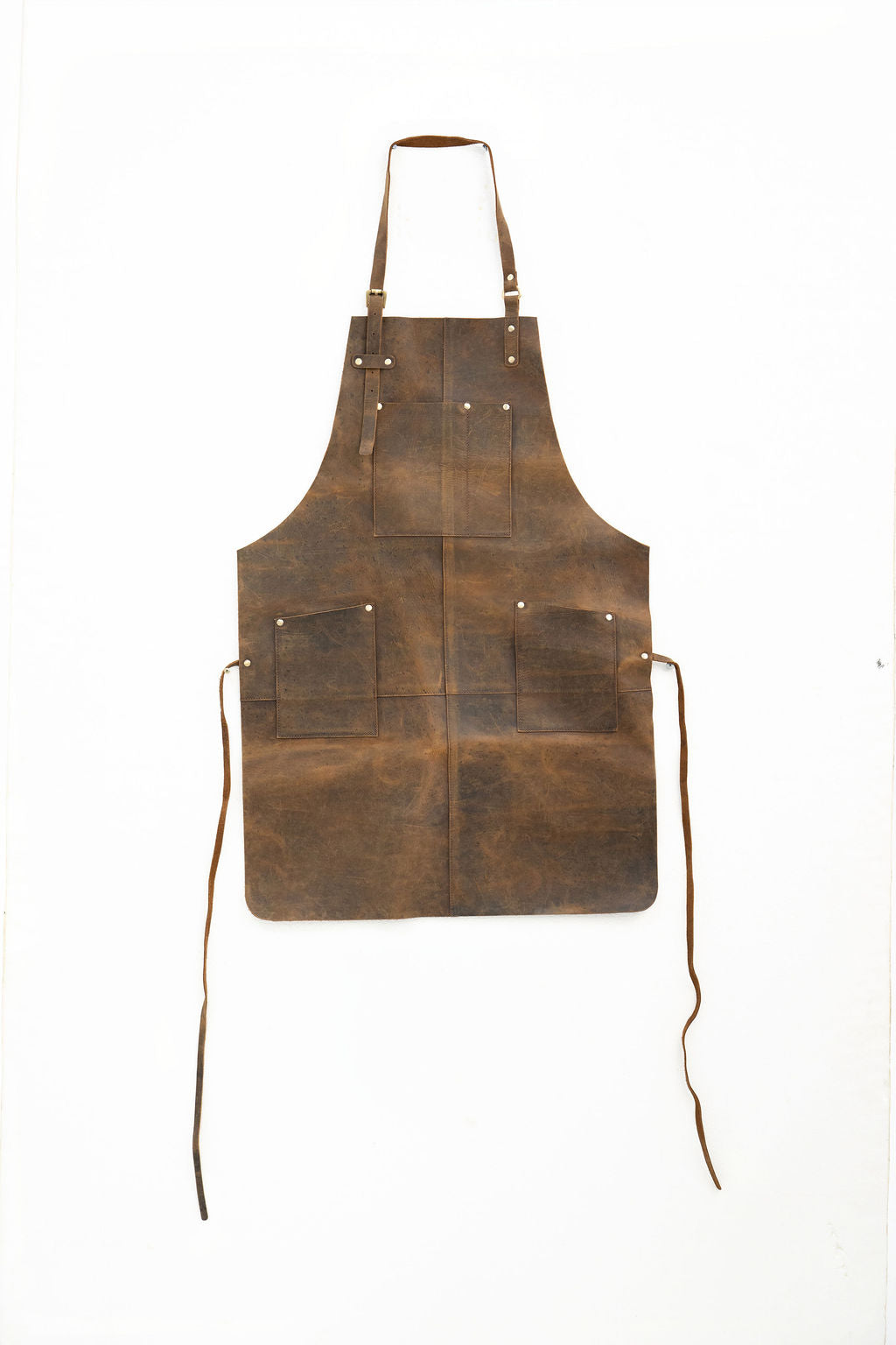 Durable brown leather work apron with pockets for woodworking and crafting