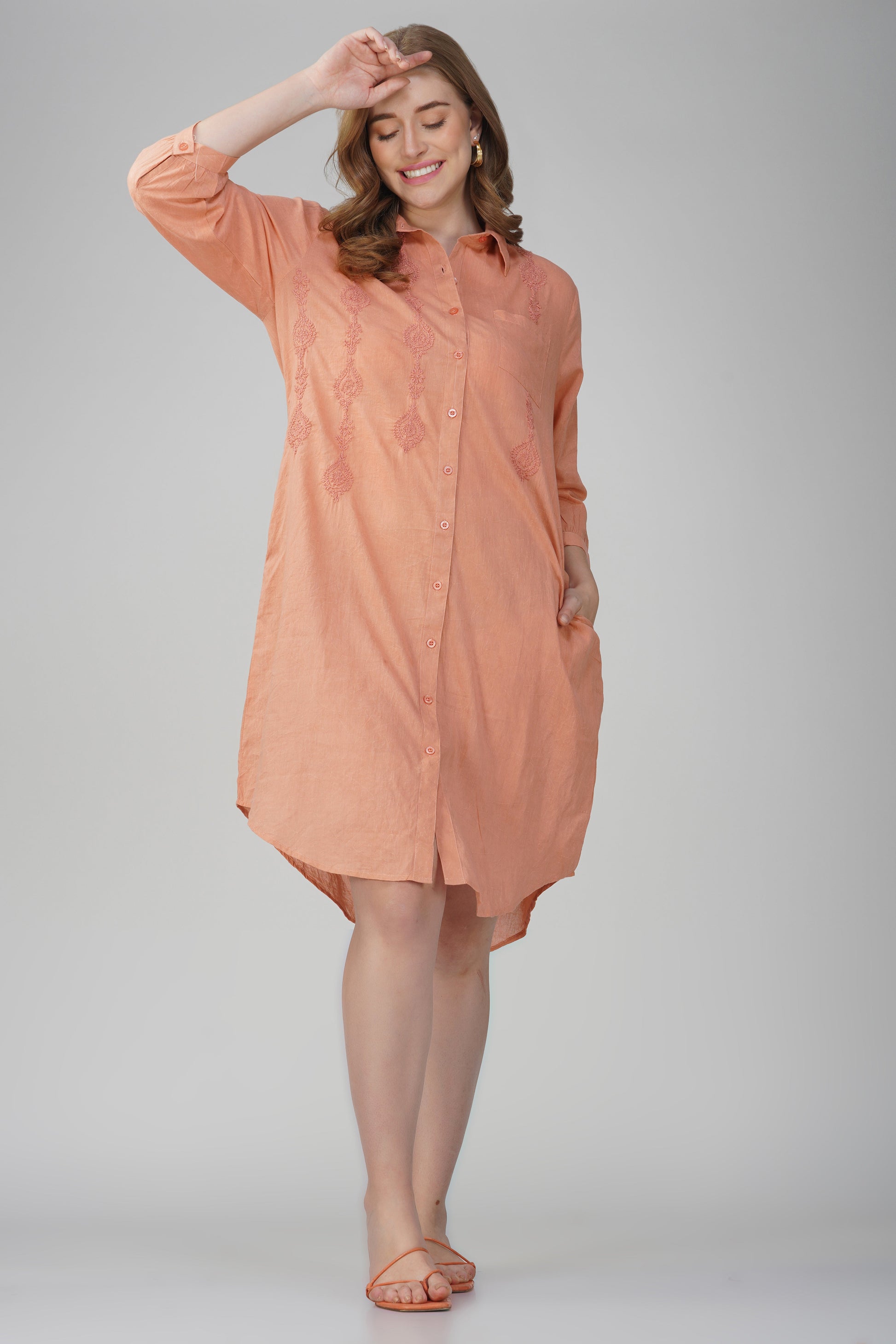 Close-up embroidery detail on peach cotton shirt dress by Glam Thread