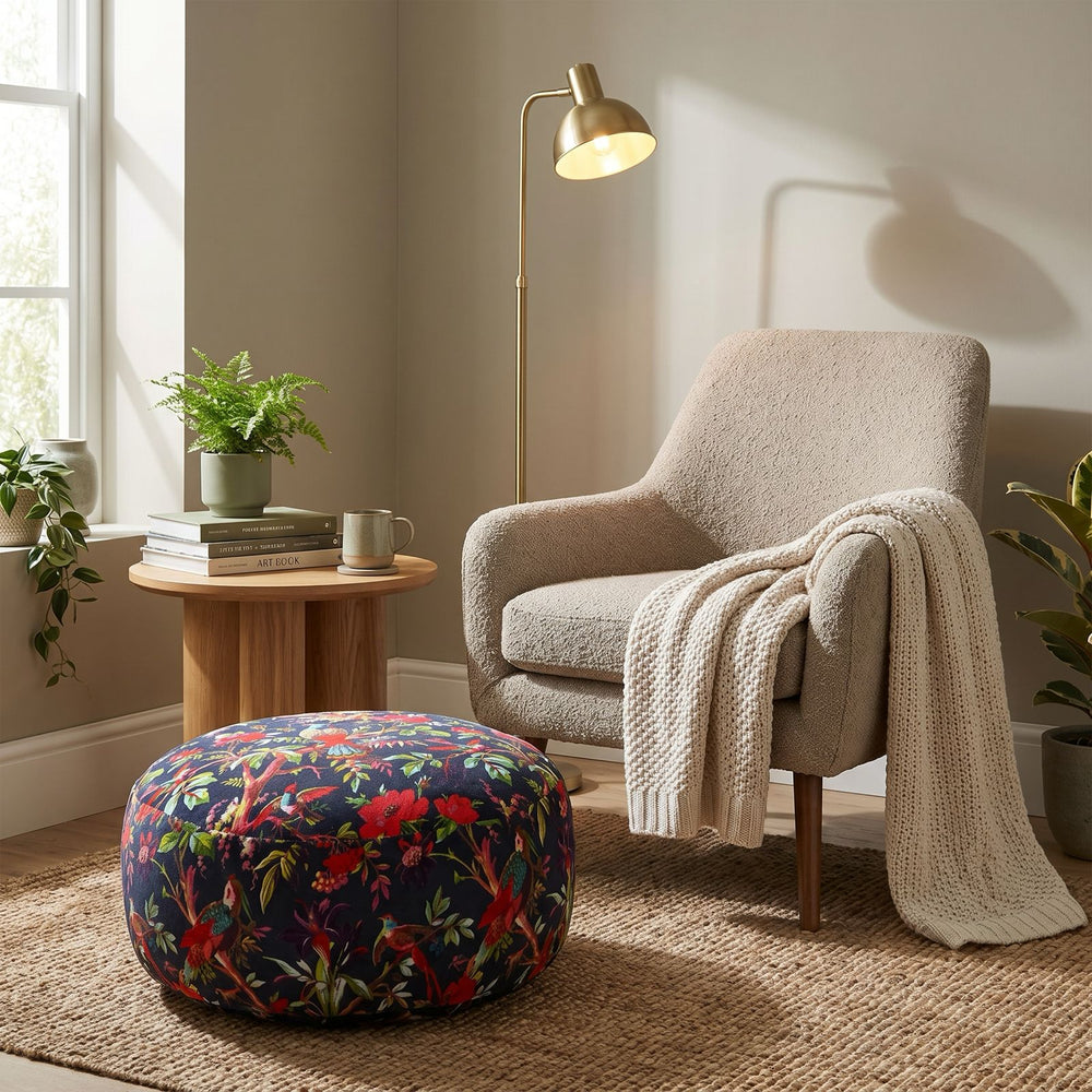 Round bird and floral floor pouf with vintage-inspired print and soft upholstered finish
