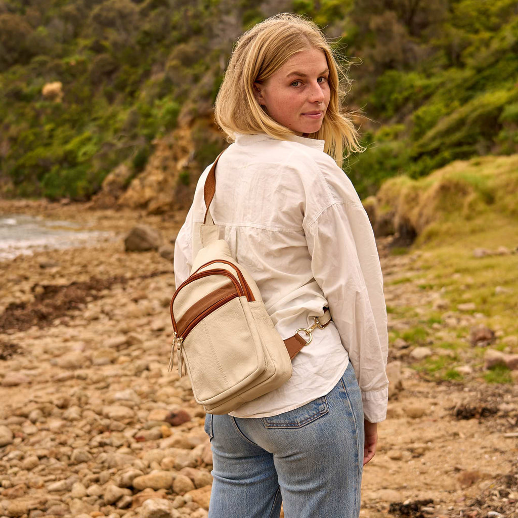 Women's genuine leather crossbody travel bag with adjustable strap and secure zip compartments