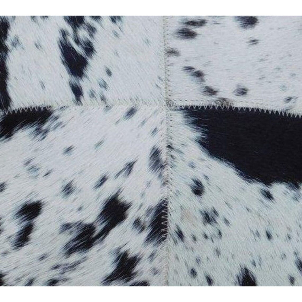 Natural black and white cowhide leather cushion cover as a bold glam home accent