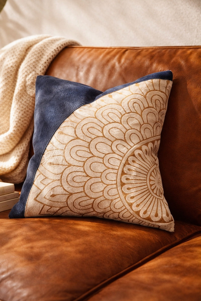 Decorative blue and cream mandala leather cowhide cushion as a glam boho home accent
