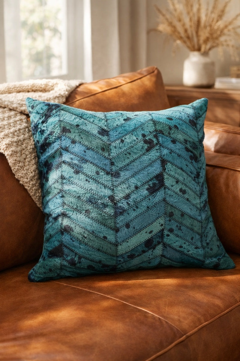 Premium teal leather cowhide cushion cover styled in contemporary living room