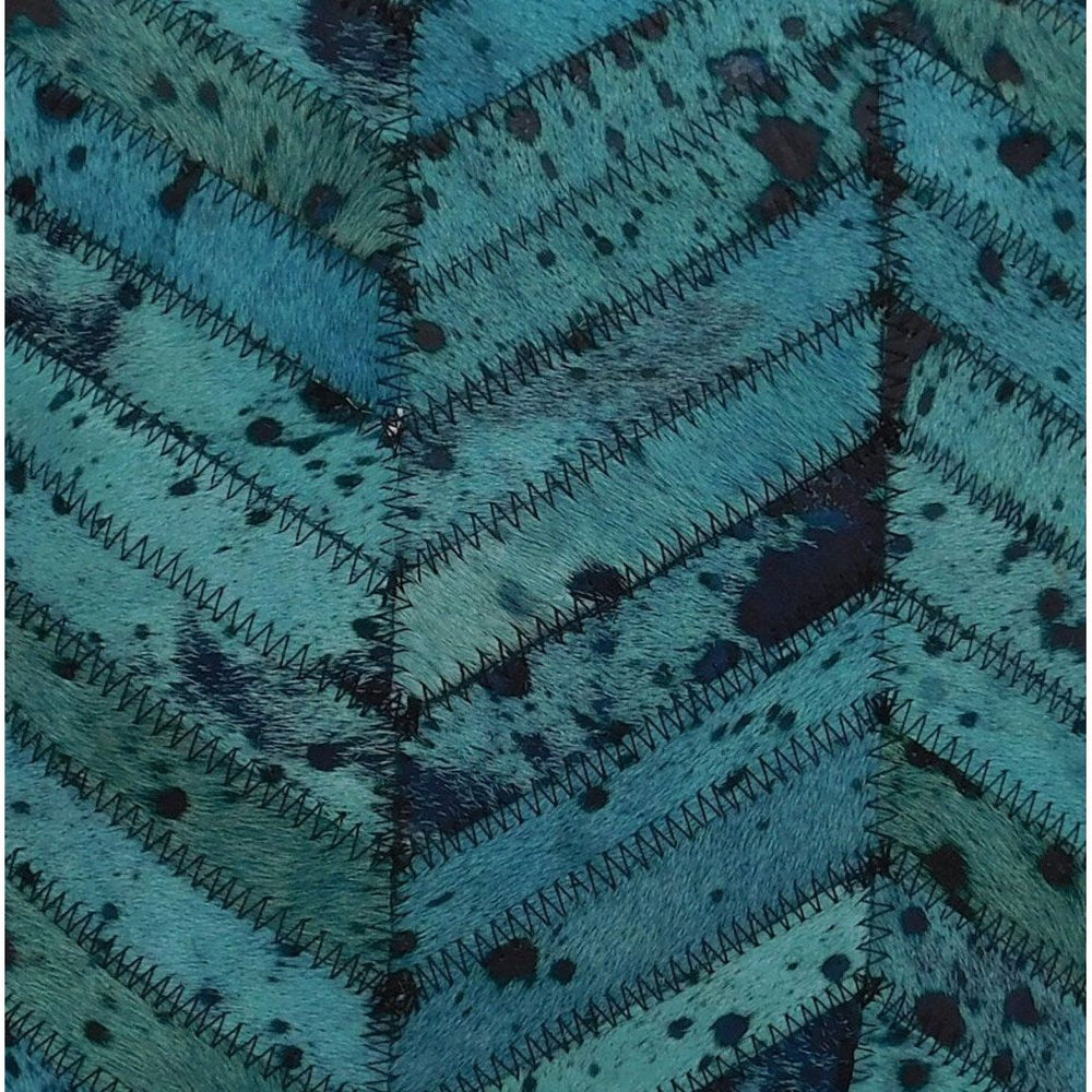 Teal hide and leather patchwork cushion cover with luxe texture and sheen