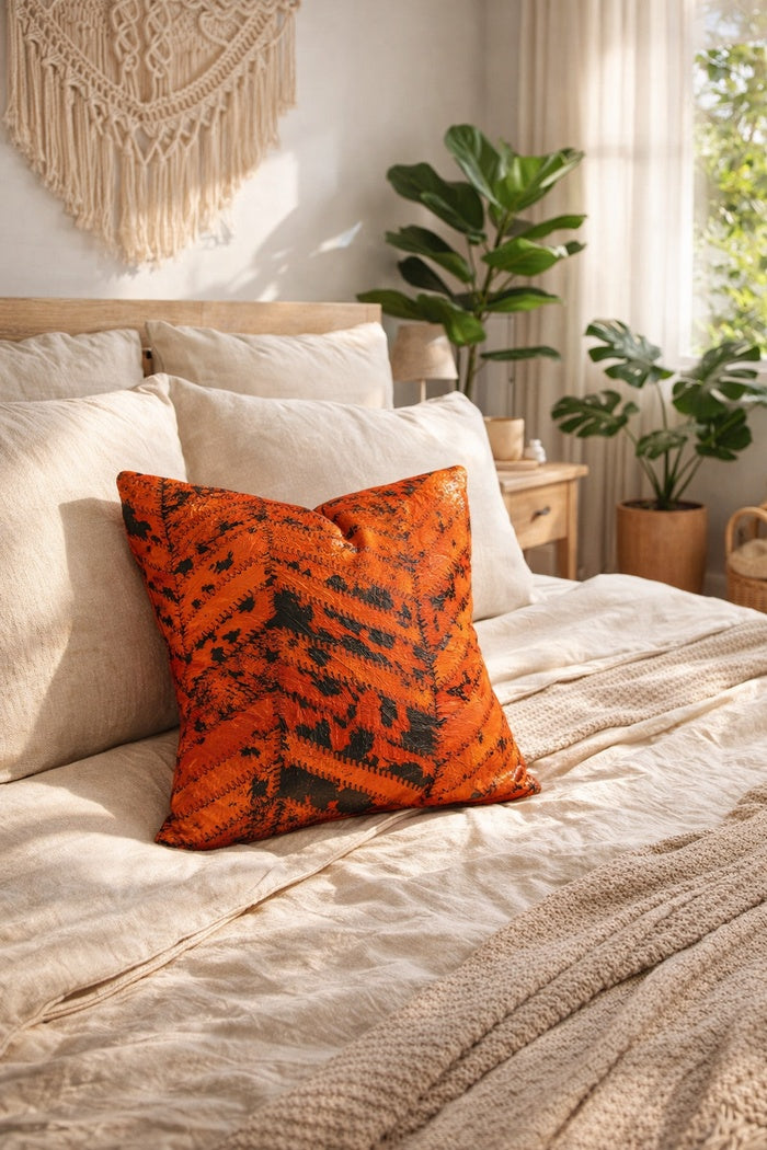 Luxury orange and black leather cowhide cushion cover as a statement home accent