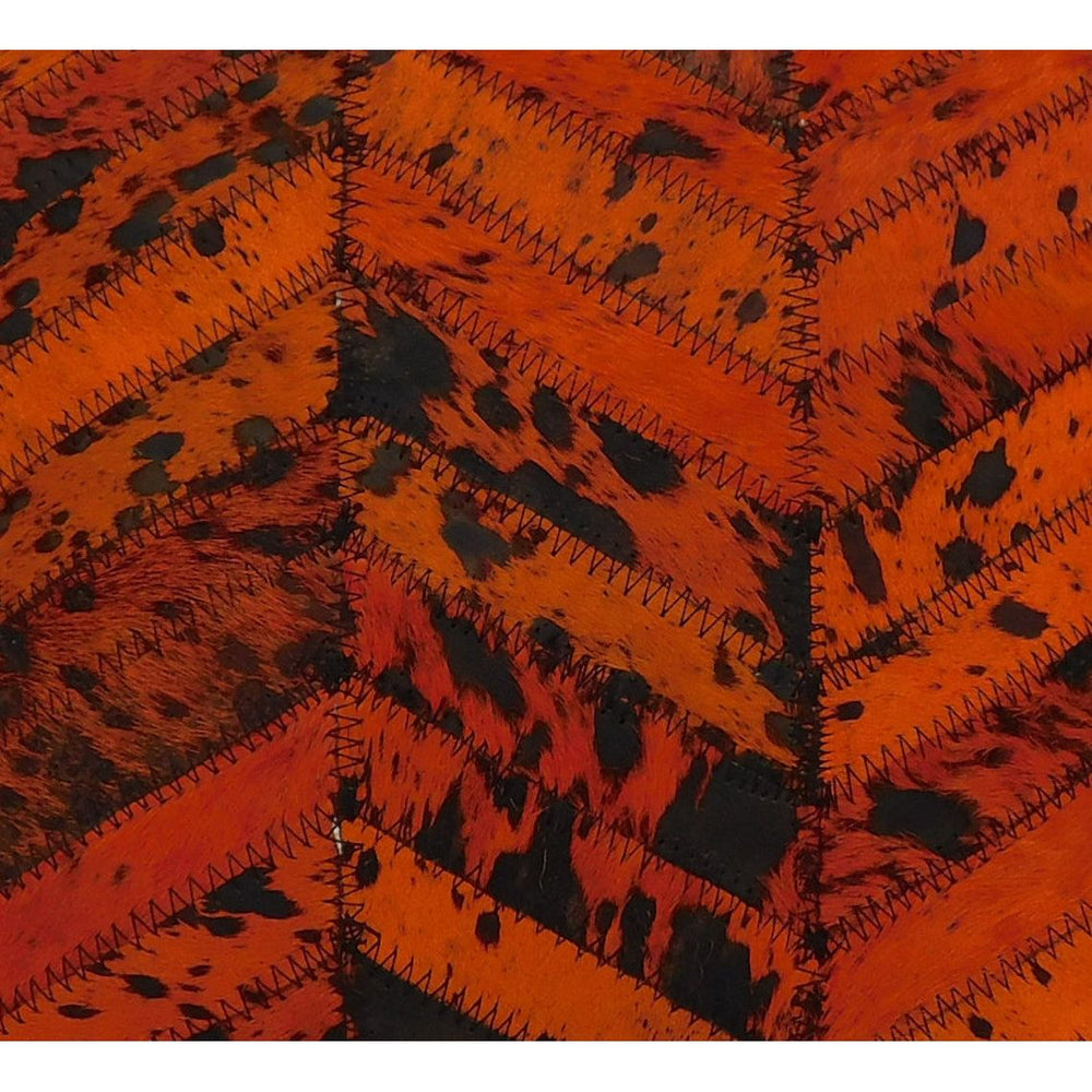 Rustic orange and black cowhide cushion cover designed for farmhouse and glam decor