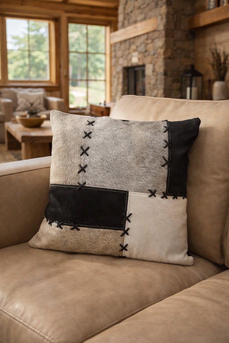 Luxury cowhide cushion cover 45x45 in black, grey and cream patchwork with X-stitch detail