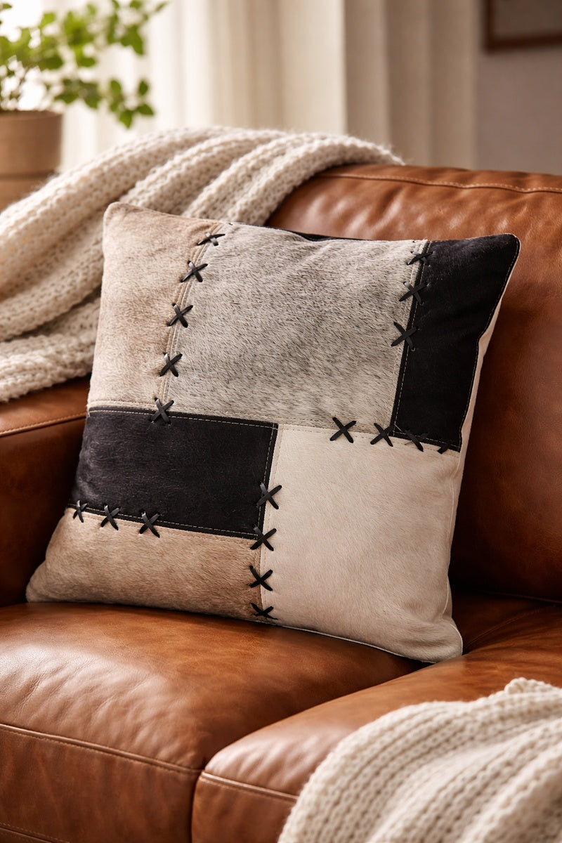 Glam black and cream cowhide patchwork pillow cover 45x45cm with decorative cross stitching