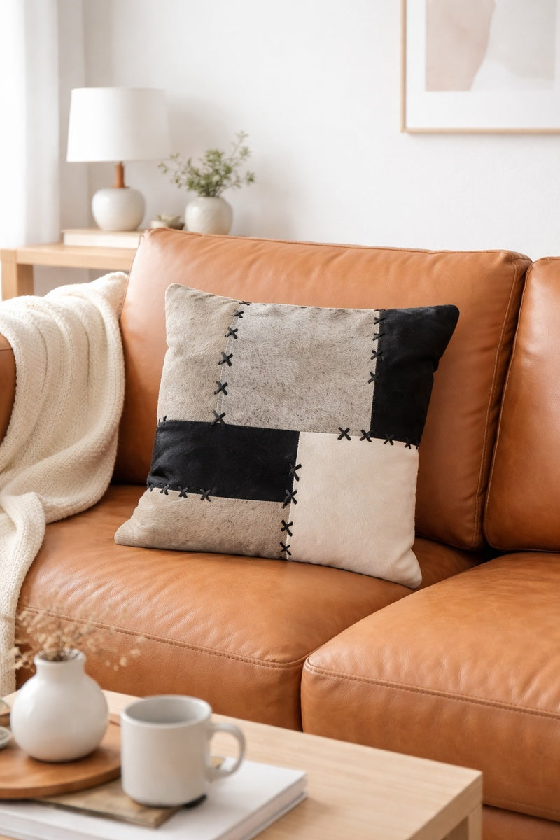 Modern luxe cowhide cushion cover in grey and black tones, square 45x45 design